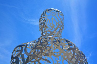 MONTREAL CANADA - 05 20 2020: Source a stainless-steel sculpture consists of a random intertwining of letters taken from Latin, Greek, Chinese, Arab, Cyrillic, Hindi, Hebrew, and Japanese alphabets