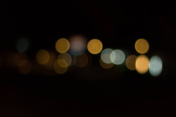 Blurred image of lights during the night (car light)