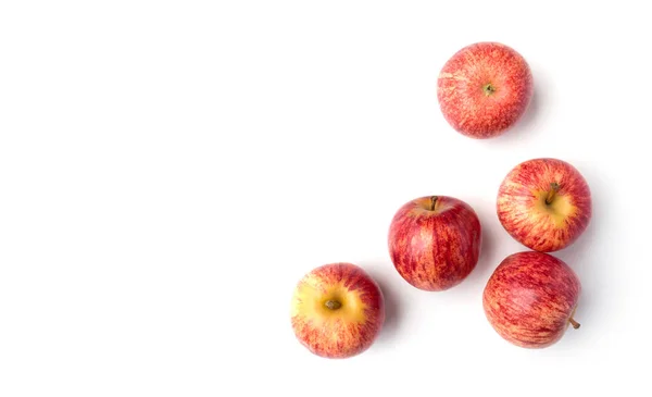 แอปเปิ้ลสีแดงสดแยกกันบนพื้นหลังสีขาว ภาพถ่ายสต็อกที่ปลอดค่าลิขสิทธิ์