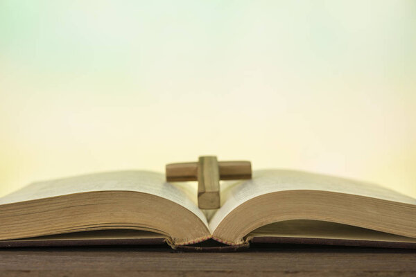 Open bible book on wood table 