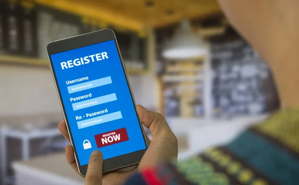 Register Membership Application on mobile smartphone against the background blurred cafe, Business Concept. soft focus.