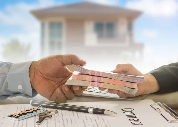 Mortgage loan real estate property concept. Banker give loan money to debtor.