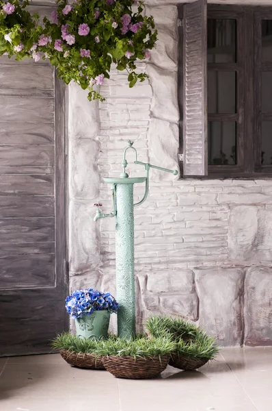 Garden decoration - metal standpipes with baskets — Stock fotografie