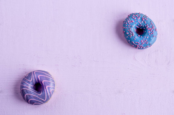 Two Donuts Blue Violet Glaze Flat Lie Diagonally Pink Background — Stock Photo, Image