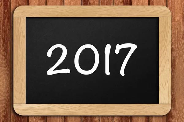 Inspirational motivating quote of 2017 on chalkboard with wooden — Stock Photo, Image