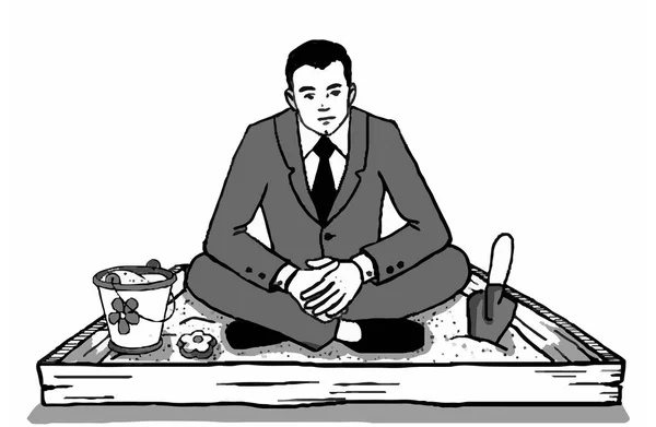 Adam kum havuzunda oturuyor