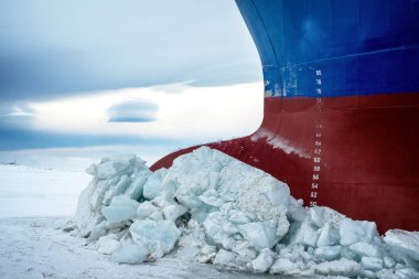 Nose icebreaker stuck in the ice of the Arctic landscape. Begins a snow Blizzard. clipart