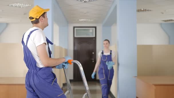 Young Woman Man Work Uniform Clean Office Vacuum Cleaner — Stock Video