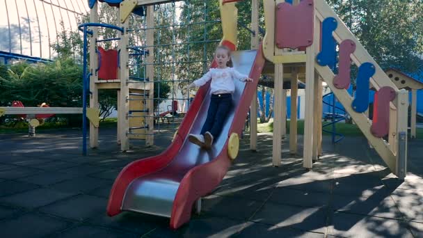 Little girl in play yard — Stock Video