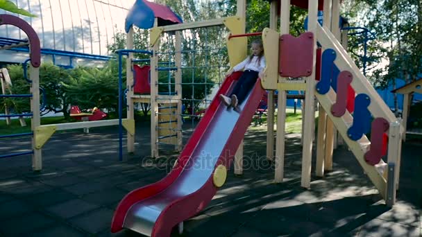 Little girl in play yard — Stock Video