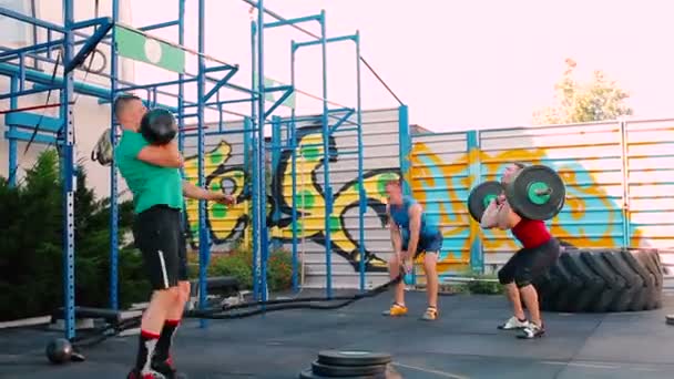 Muscular men workout in outdoor gym — Stock Video