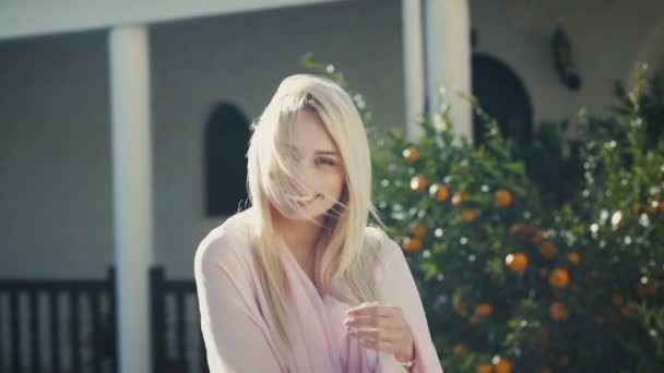 Charming blonde woman in garden — Stock Video