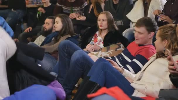 Young People Watching Comic Performance Smile Men Women Sitting Floor — Stock Video
