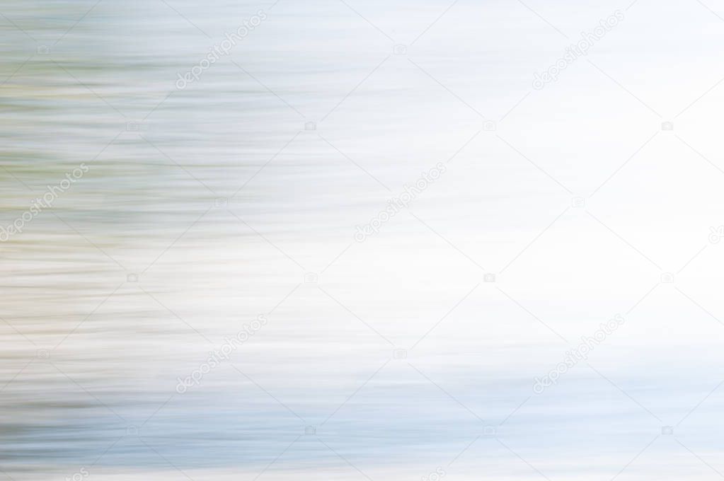 Blurred abstract background. Pale blue and white.