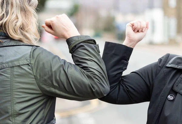 Elbow bump. Novel greeting to avoid spread of coronavirus — Stock Photo, Image