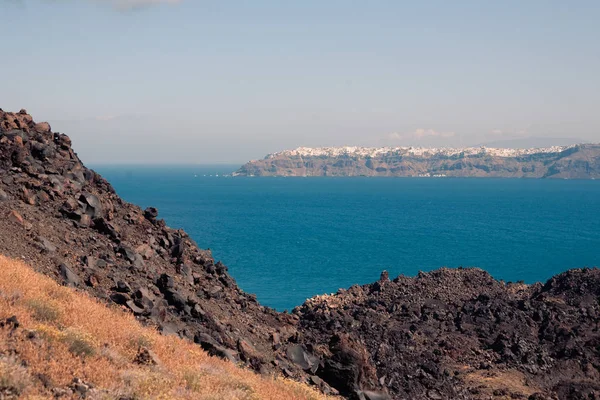 View on the Nea Kameni volcano island near Santorini island at sunny weather at Greece — Stock Photo, Image