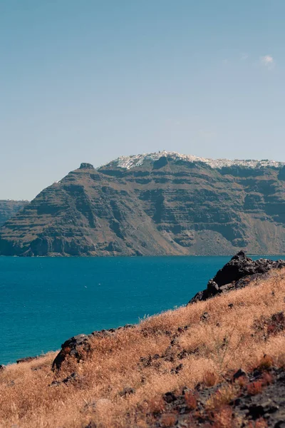 View on the Nea Kameni volcano island near Santorini island at sunny weather at Greece — Stock Photo, Image