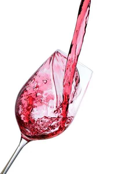 Red wine pouring into a wineglass — Stock Photo, Image