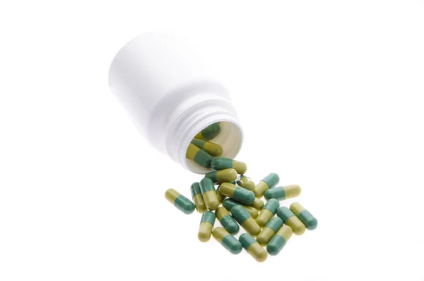 Contenedor con pastillas verdes —  Fotos de Stock