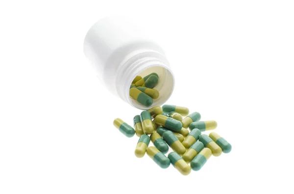 Container met groene pillen — Stockfoto