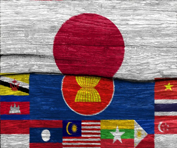 japonya ve Aec ve ahşap doku backgro üzerinde Aec bayrağı tüm ulus