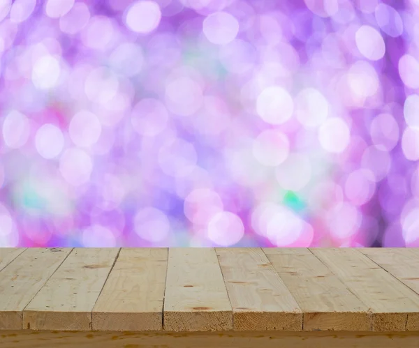 wood table top on abstract white and violet bokeh light backgrou