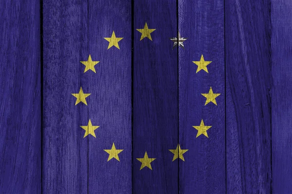 EU flag on wood texture background with UK out of member — Stock Photo, Image