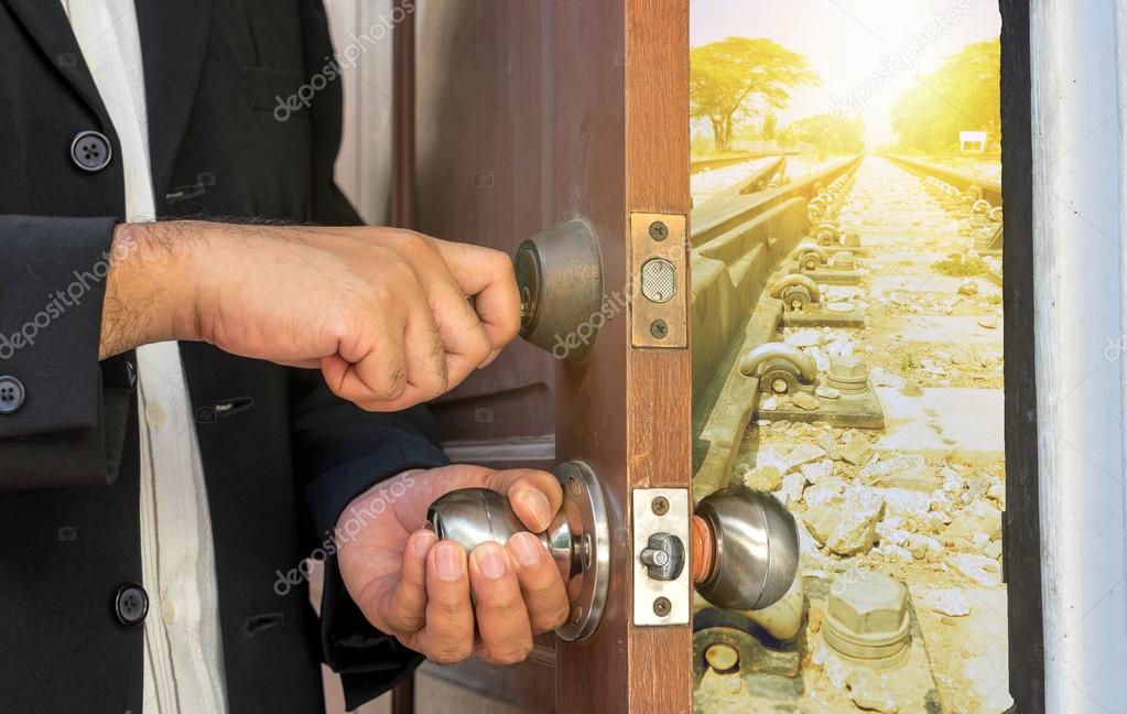 Man In Black Suit Open The Door By Key To Train Railway Stock