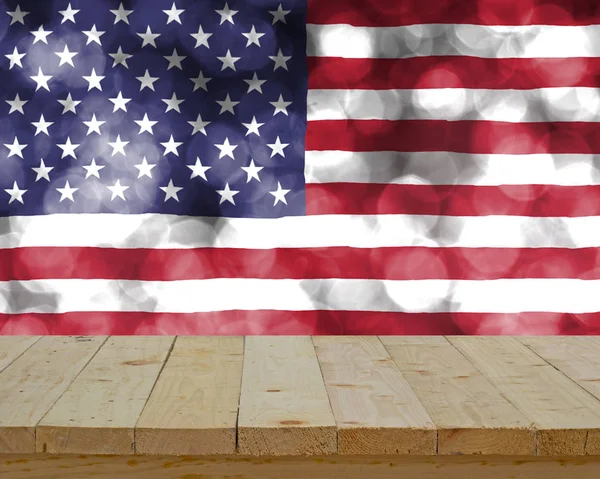 Wood table top on blur abstract USA flag on bubble bokeh light b — Stock Photo, Image