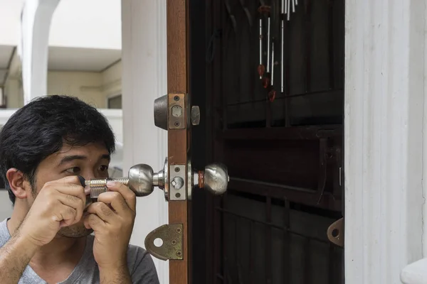locksmith open the home door by his tools and his technic