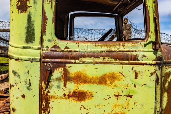 A rusting abandoned truck sits in a field in southern Idaho.