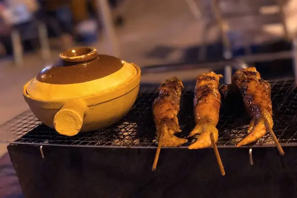 Outdoor barbecue chicken wing on metal net grilled — Stock Photo, Image