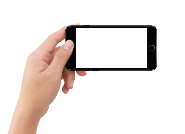 Изолированная левая рука человека держит черный мобильный телефон — стоковое фото
