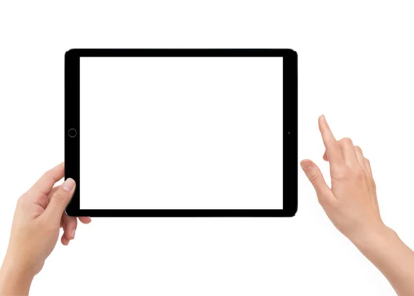 Isolated human left hand holding black tablet computer — Stock Photo, Image