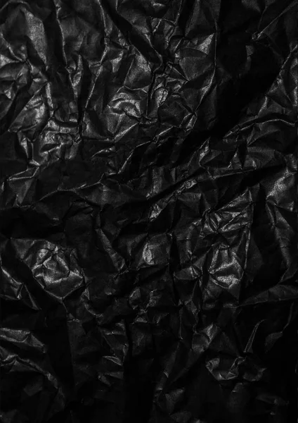 Papel enrugado texturizado preto abstrato em branco — Fotografia de Stock