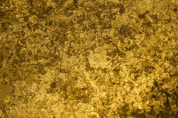 Goldene Stücke und Pailletten strukturierten Hintergrund — Stockfoto