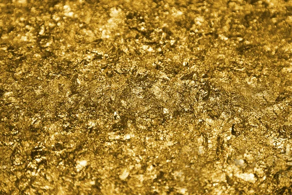 Goldene Stücke und Pailletten strukturierten Hintergrund — Stockfoto