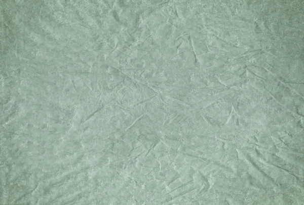 Zöld üres gyűrött és szutykos texturált papír háttér — Stock Fotó