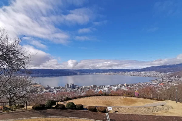 Japan town, resident buildings, outdoor park near bay with white cloud and blue sky