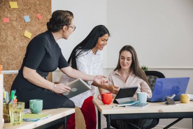 Female Workers In An Office clipart