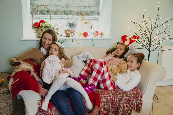 Watching Christmas Television With Mum Royalty Free Stock Photos