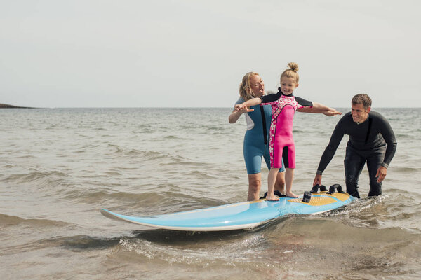 Little Girl Learning how to Surf
