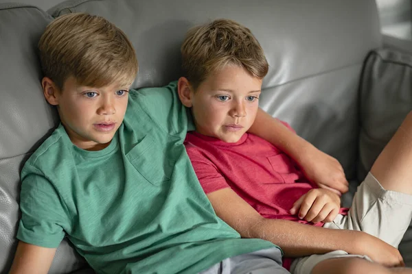 Shot Two Young Brother Sitting Couch Together Watching Wearing Casual — Stock Photo, Image