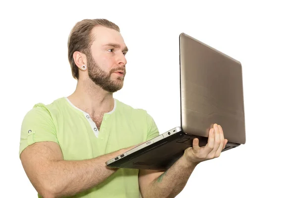 Homem com um laptop em um fundo branco — Fotografia de Stock