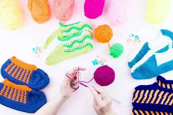 Girl knits sock knitting needles — Stock Photo, Image