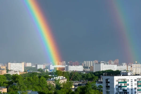 Sunset and rainbow colors over town. Rainbow in Moscow