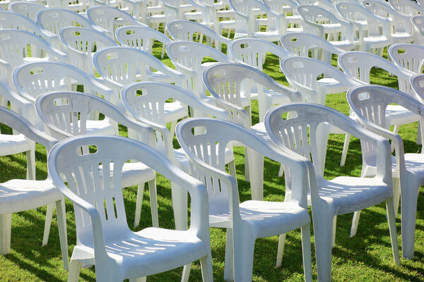Vacant plastic white chairs pattern