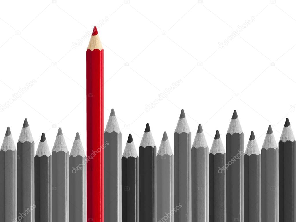 Red pencil standing out from crowd isolated