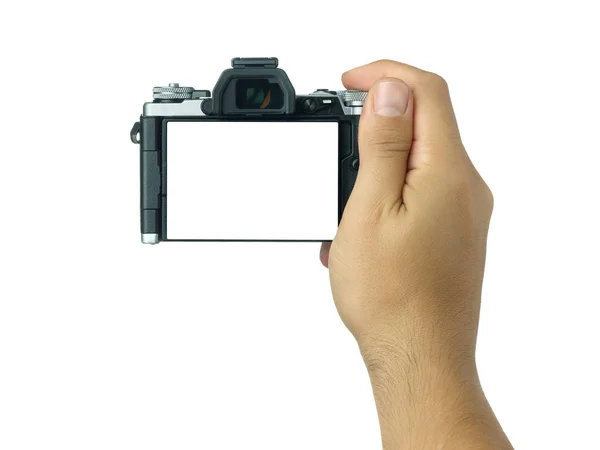 Mão segurando e tomando tiro com display em branco camer sem espelho — Fotografia de Stock