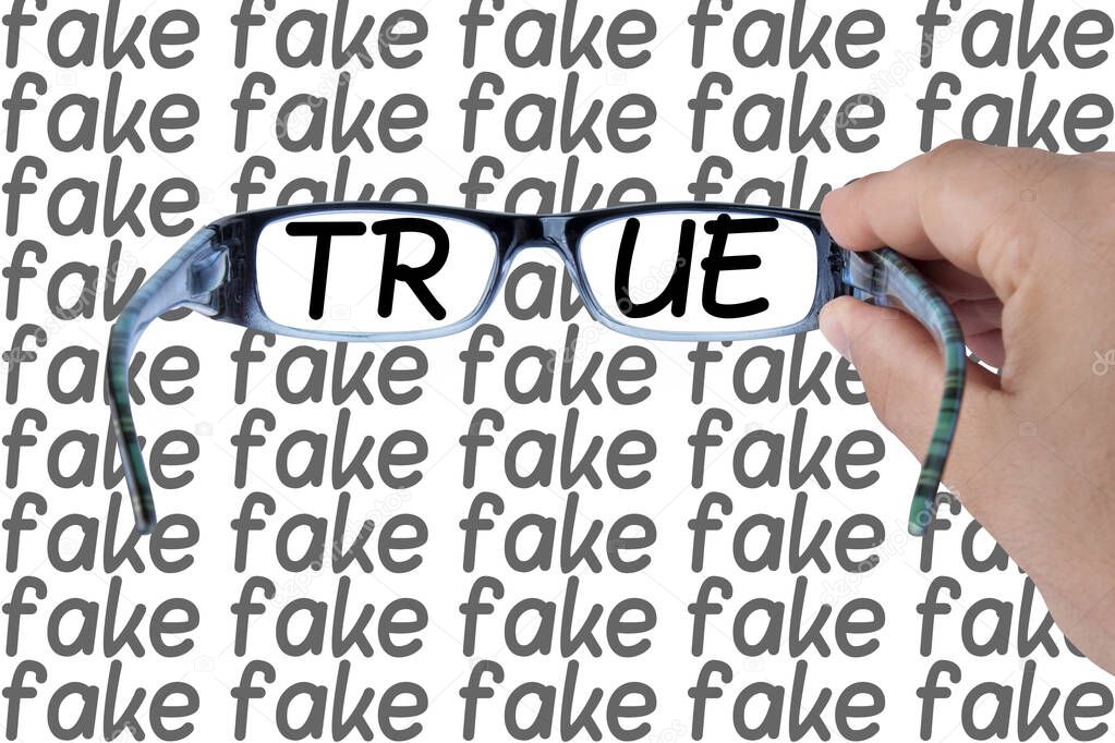 Truth spotted among fakes hands holding glasses focusing on opportunity word. Concept image
